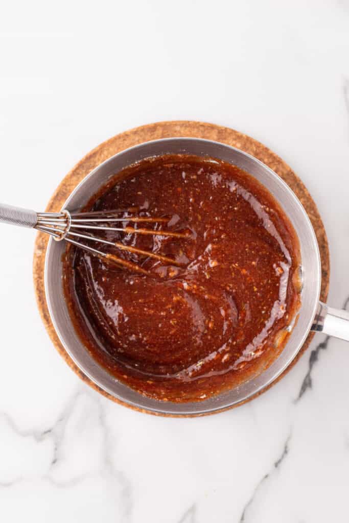 BBQ ranch sauce ingredients whisked together in a small saucepan