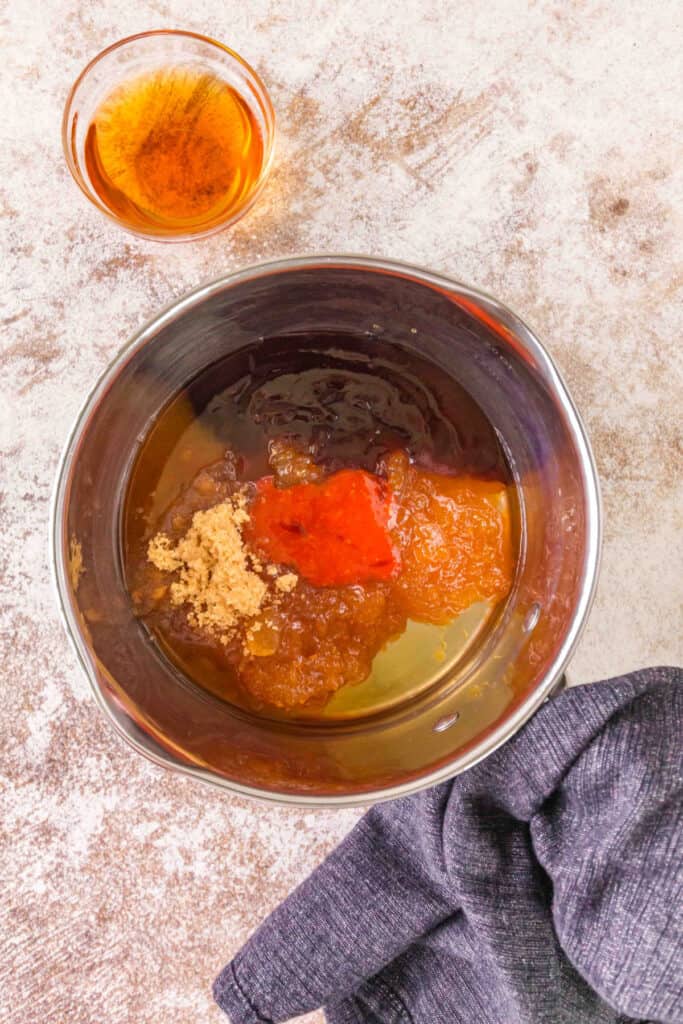 Peach bourbon BBQ sauce ingredients combined in a saucepan before simmering