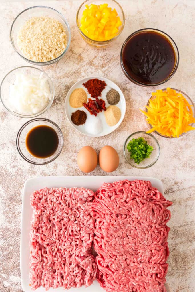 Ingredients for Smoked Cowboy Meatloaf arranged on a work surface