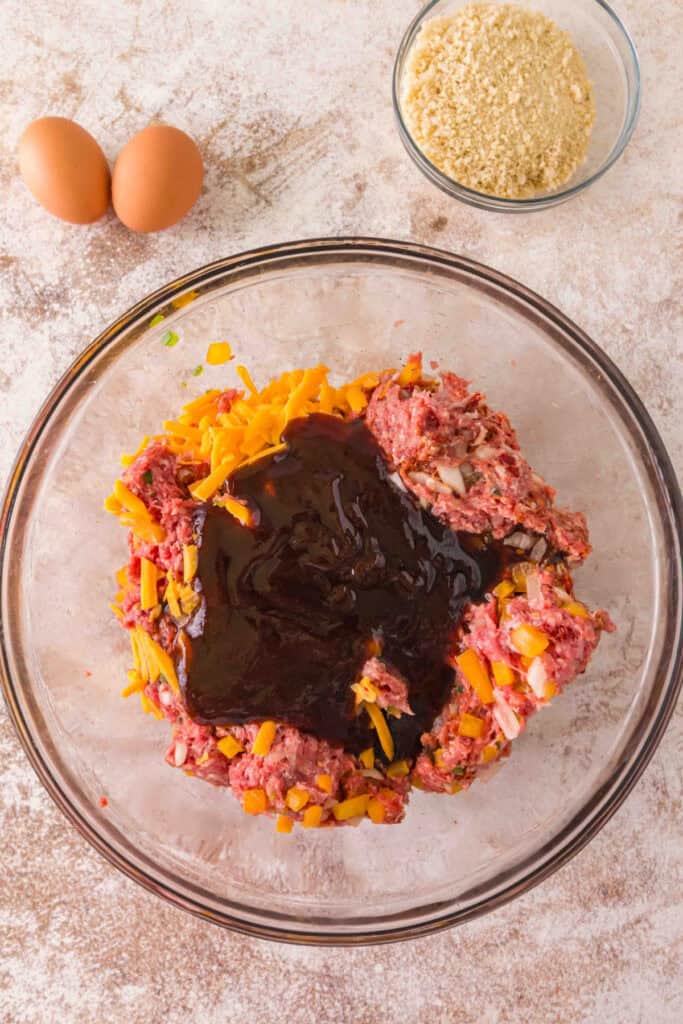 BBQ sauce and Worcestershire sauce added to the meatloaf mixture with cheese and vegetables
