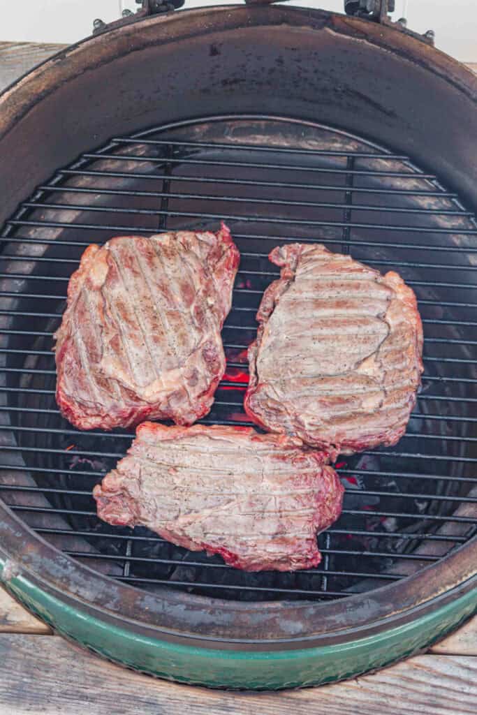 Ribeye steaks returned to the hot grill for the final direct-heat sear.