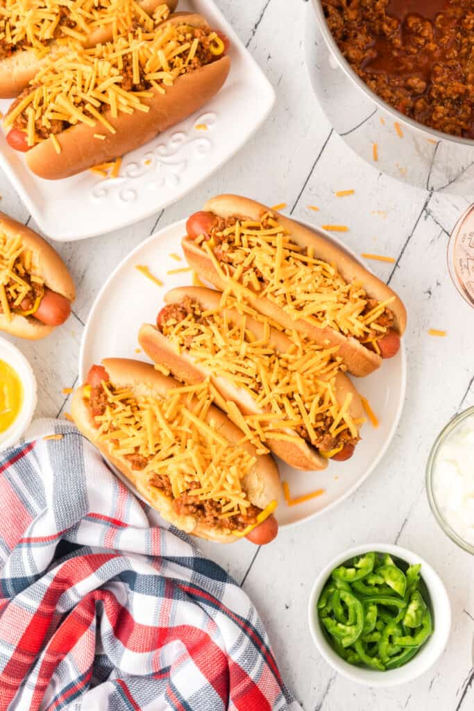 Texas Chili Dogs topped with homemade chili and shredded cheddar cheese