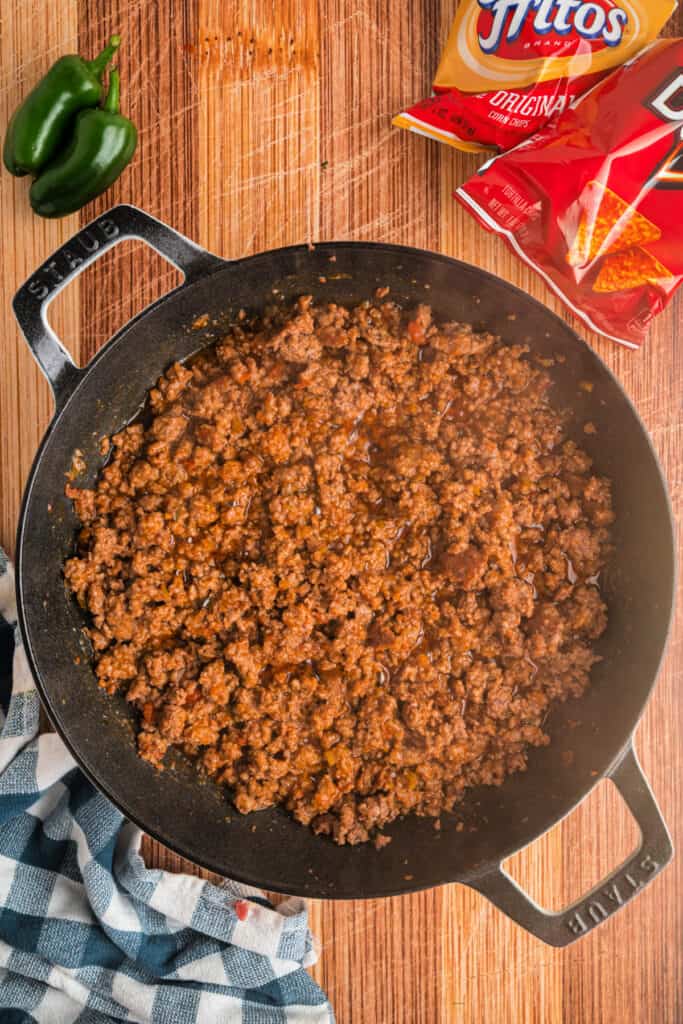 Seasoned ground beef simmering in a skillet for easy Walking Tacos