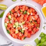 Square overhead photo of Watermelon Feta Mint Salad with juicy watermelon, cucumber, feta cheese, and fresh mint.