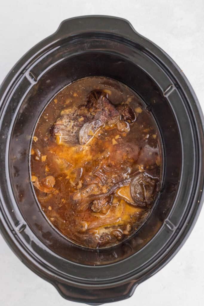Tender chuck roast after slow cooking in the savory soy, ginger, and garlic sauce