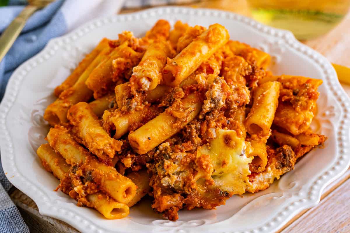 Baked ziti casserole with golden melted cheese in a baking dish