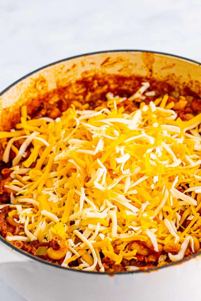 Shredded cheddar and Monterey Jack cheese added to Chili Mac