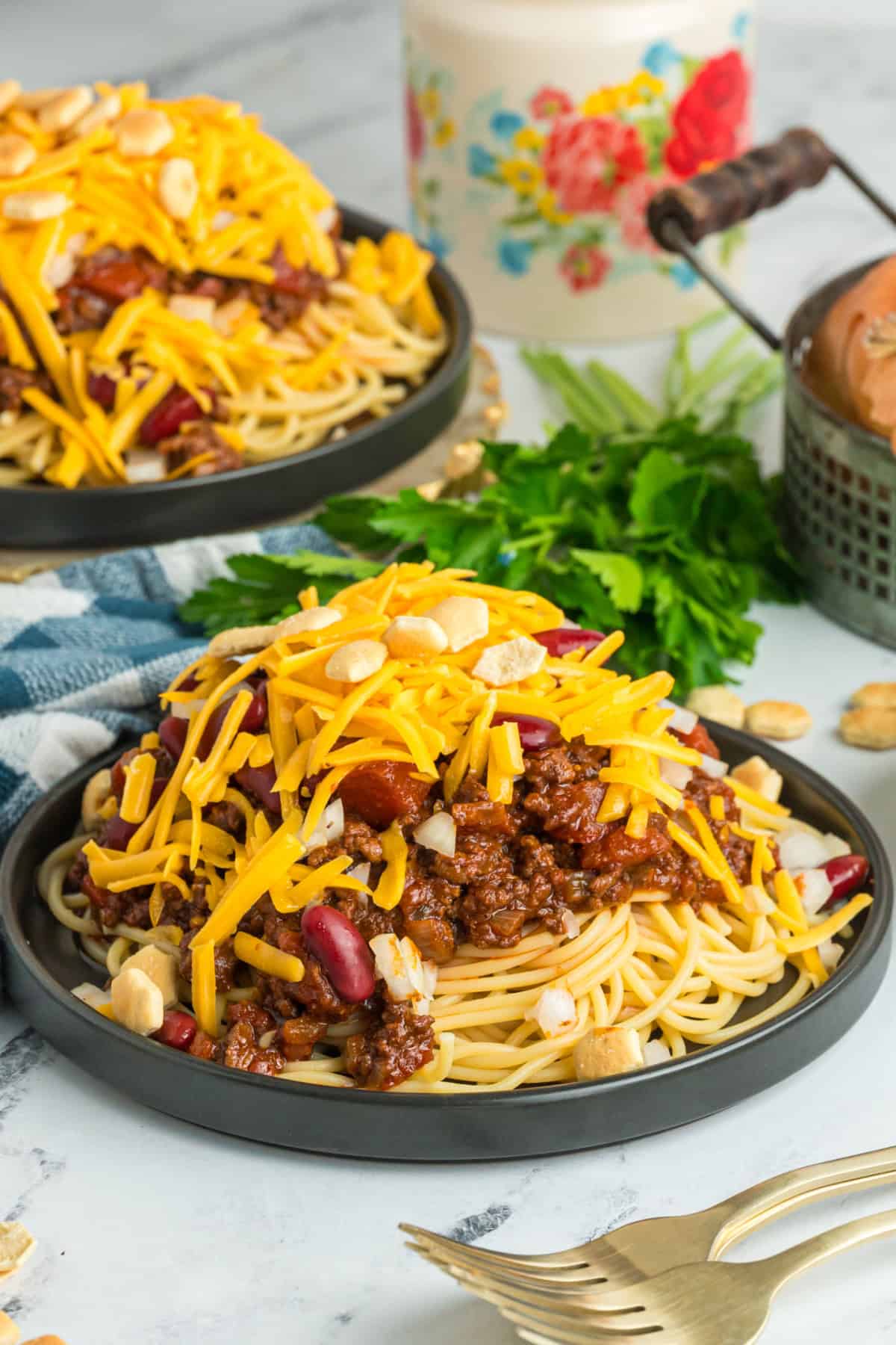 Cincinnati chili served over spaghetti with shredded cheddar cheese