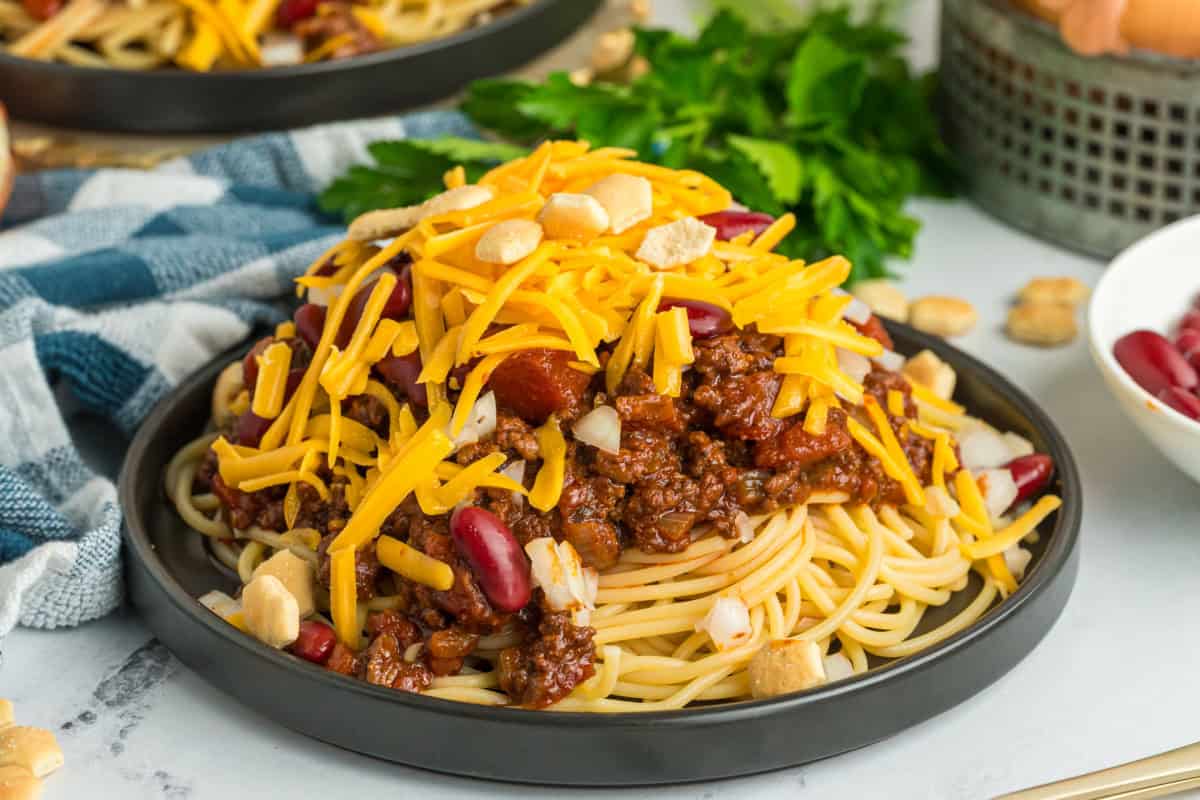 Plate of Cincinnati chili and spaghetti with toppings