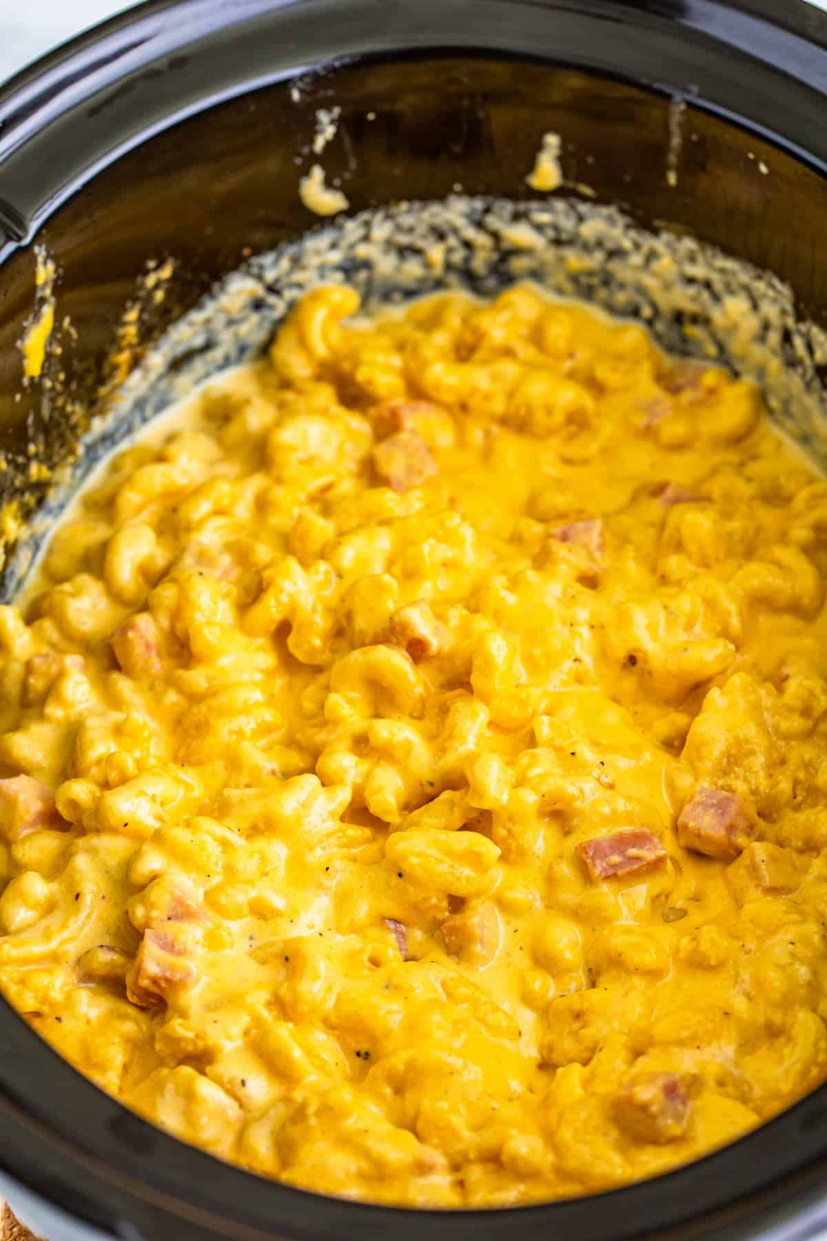 Step 3 of making slow cooker ham mac and cheese.