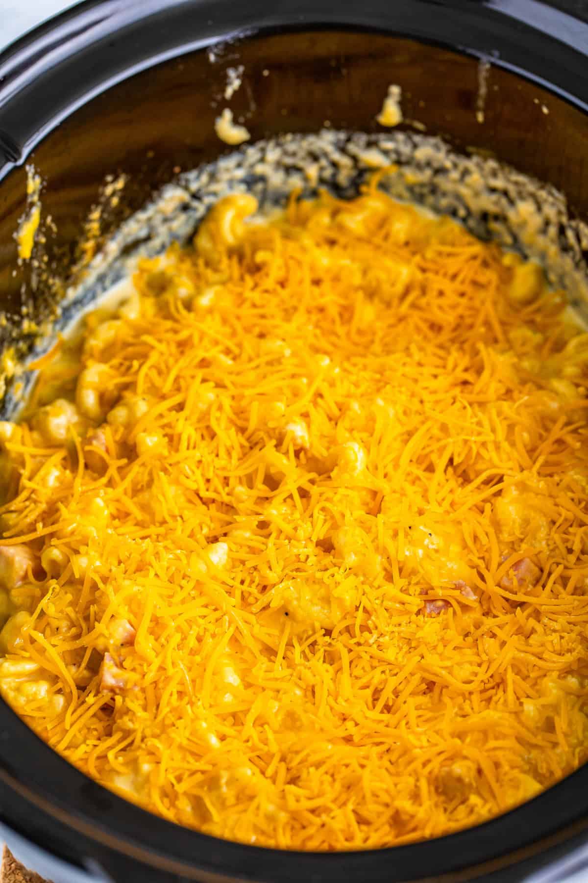 Step 4 of making slow cooker ham mac and cheese.