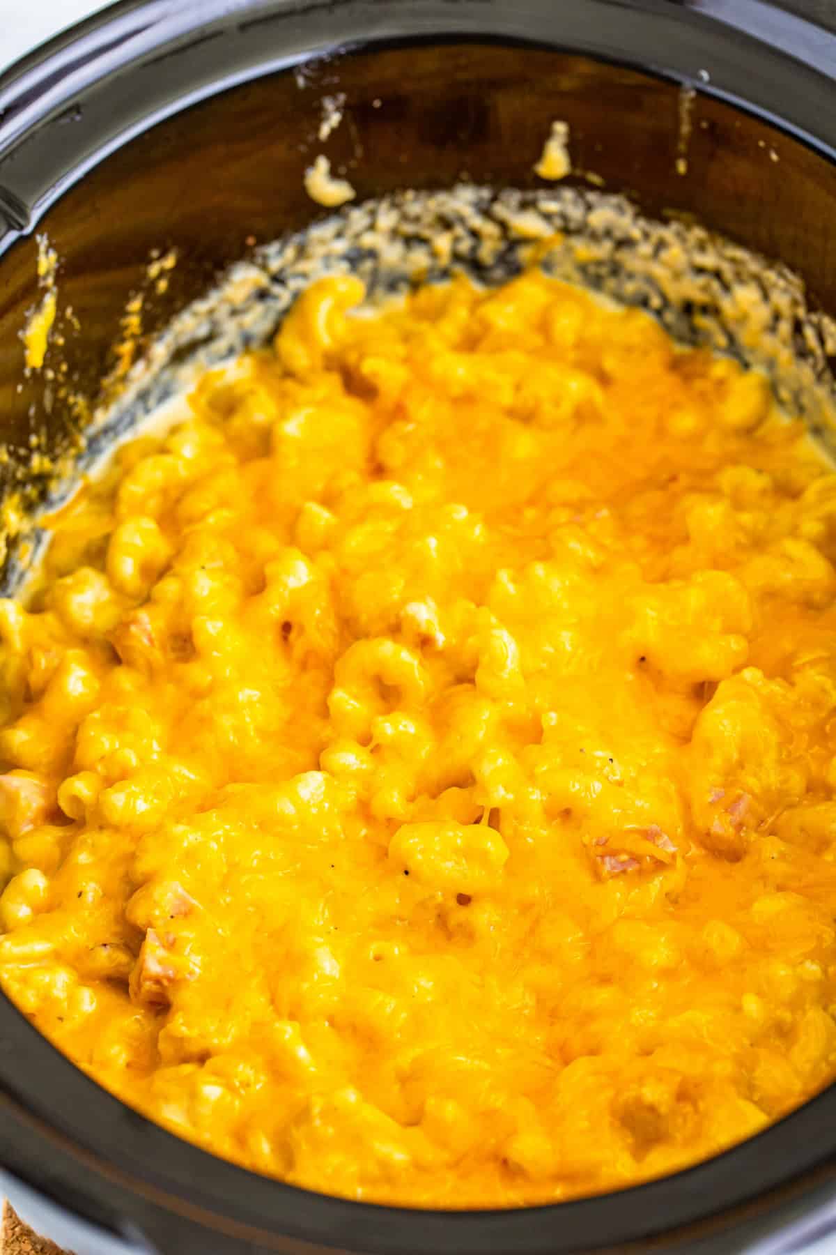 Step 5 of making slow cooker ham mac and cheese.