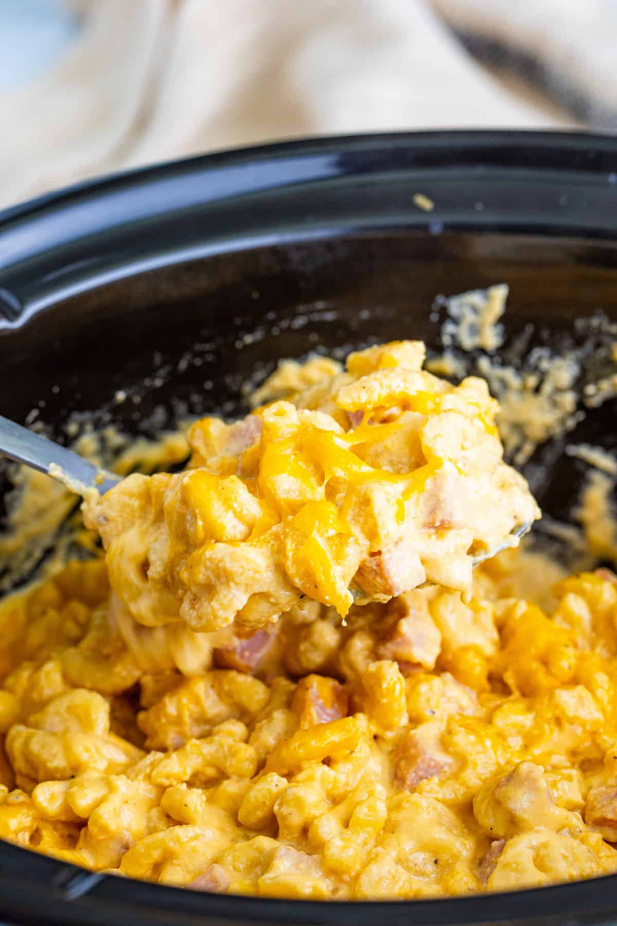 Step 6 of making slow cooker ham mac and cheese.