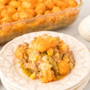 Breakfast tater tot casserole with sausage, eggs, and melted Colby Jack cheese