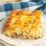 Breakfast tater tot casserole with sausage, eggs, and melted Colby Jack cheese.