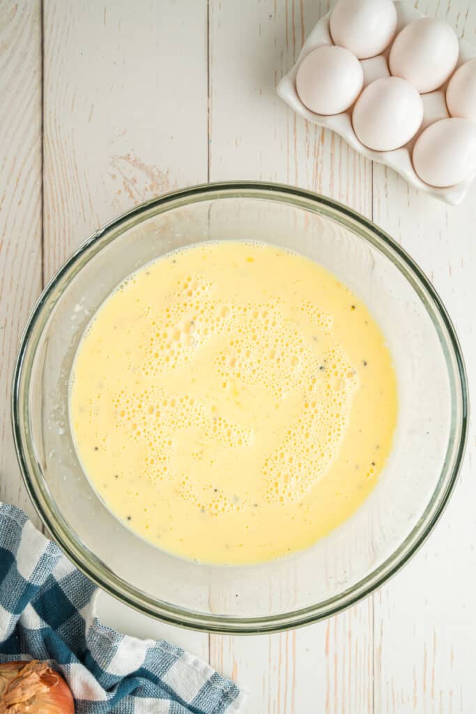 Eggs, milk, and seasonings whisked together.